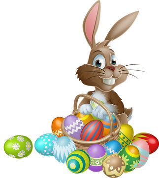 Easter bunny rabbit with Easter basket full of decorated Easter eggs