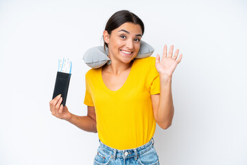 Woman with Inflatable Travel Pillow over isolated background saluting with hand with happy expression