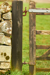 Wooden cattle gate with metal spring latch closeup at the Holy Cairn Standing Stones Newton Stewart...
