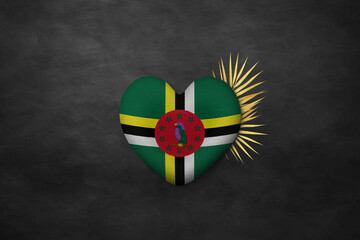Textile heart in colors of national flag. Photography and marketing digital backdrop. Dominica