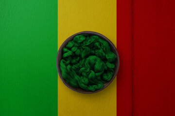 Wooden basket on background in colors of national flag. Photography and marketing digital backdrop....