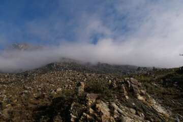 White mist rolling over the top of Matroosberg Mountains, Ceres, Western Cape