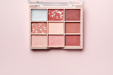 Eyeshadow colorful shades palette in beige tones. Beauty abstract background