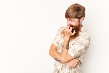 Young caucasian red-haired man isolated on white background relaxed thinking about something looking at a copy space.