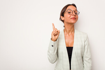 Young hispanic woman isolated on white background showing number one with finger.