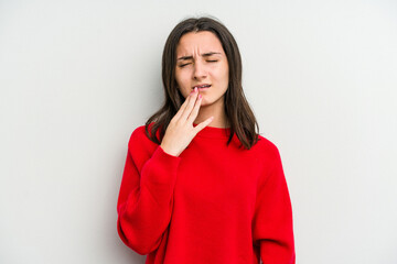 Young caucasian woman isolated on white background yawning showing a tired gesture covering mouth with hand.