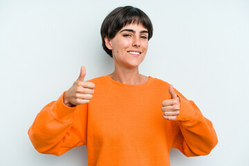 Young caucasian woman with a short hair cut isolated raising both thumbs up, smiling and confident.