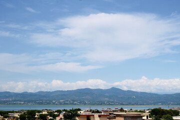 Beautiful Mountains behind the city and river, Skyline view shot