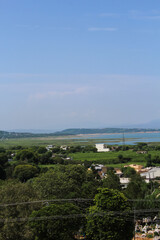 Beautiful Mountains behind the city and river, Skyline view shot