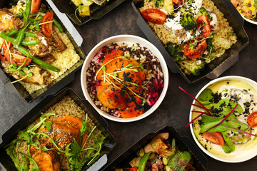 Ready healthy food menu in lunch boxes with fish, meat and vegetable packages as daily courier...
