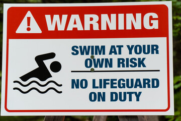 Swim at your own risk no lifeguard on duty