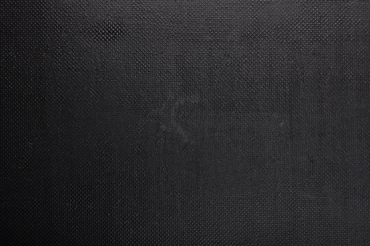black rough plastic surface with regular artificial pimply bumps - full frame background and texture