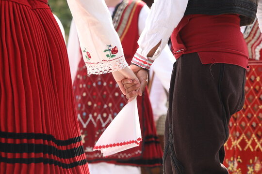 People in traditional folk costume of The National Folklore Fair in Koprivshtica. The National Folklore Fair in Koprivshtica is entered in the UNESCO Register of the human intangible cultural heritage
