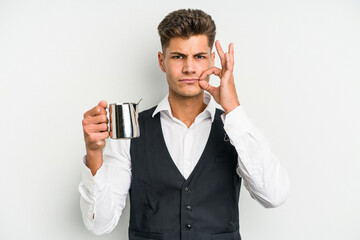 Young caucasian barista man isolated on yellow background with fingers on lips keeping a secret.