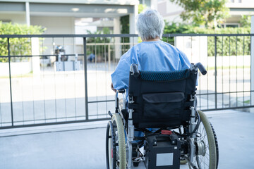Asian senior or elderly old lady woman patient on electric wheelchair with remote control at nursing hospital ward, healthy strong medical concept