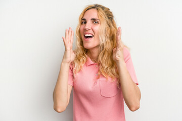 Young caucasian woman isolated on white background laughs out loudly keeping hand on chest.