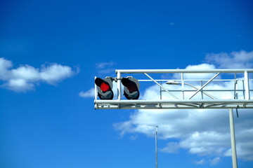 Railroad red stop light is flashing