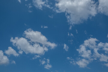 white clouds in the blue sky. cumulus.