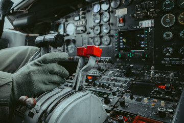 Selective focus inside classic cockpit when pilot operate airplane ,aircraft panel use analog flight instrument display - obrazy, fototapety, plakaty