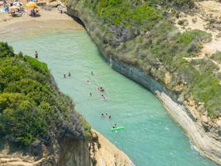 Aerial view of the promontory of Sidari in the northern part of the island of Corfu, Greece. Canal D'Amour cliffs. Bathers on the rocks and in the water
