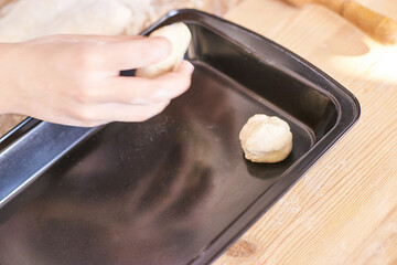 Young girl cooking at kitchen. Curly pretty child portrait. Chef student. Attractive brunette. Children emotion. People baking in cook hat and apron