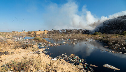 Landfill with burning trash piles