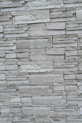 closeup the bunch grey brown stone wall soft focus natural grey brown background.