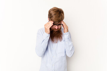 Young caucasian red-haired man isolated on white background having a head ache, touching front of the face.