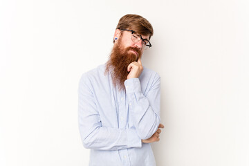 Young caucasian red-haired man isolated on white background crying, unhappy with something, agony and confusion concept.