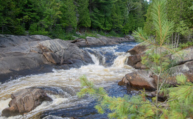 Naklejka na ściany i meble Waterfalls on a beautiful wild river in Quebec in Canada