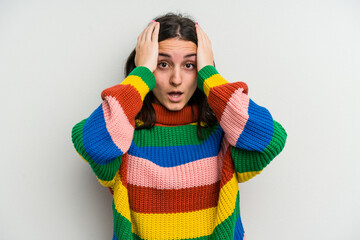 Young caucasian woman isolated on white background surprised and shocked.