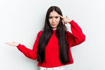 Young caucasian woman isolated on white background showing a disappointment gesture with forefinger.