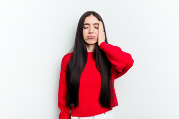 Young caucasian woman isolated on white background tired and very sleepy keeping hand on head.