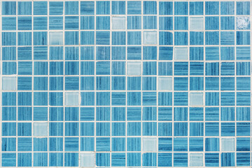 Fototapeta premium texture of small blue ceramic tiles in a chaotic manner background for elite interior of bathroom, wc, lavatory and restroom