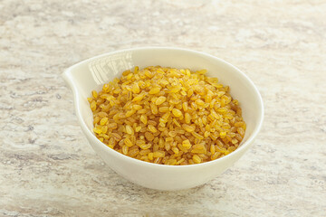 Raw bulgur in the bowl