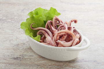 Marinated squid tentacles in the bowl