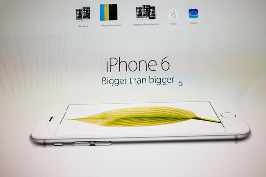 PARIS, FRANCE - September 10, 2014: Apple Computers website with newly launched smart phones Apple iPhone 6 and iPhone 6 Plus slogan Bigger than bigger as seen on 10 Sep 2014