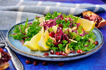 Delicious fresh salad with prawns and pomegranate.