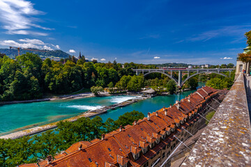 Fototapeta na wymiar View on the Kirchenfeld Bridge over the Aare River that connects Casinoplatz in the old town of Bern across the Aare with Helvetiaplatz in the Kirchenfeld district.
