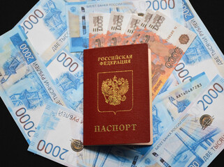 the passport of a citizen of Russia lies on Russian money. The concept of finance, investment, cash savings in the face of sanctions and crisis