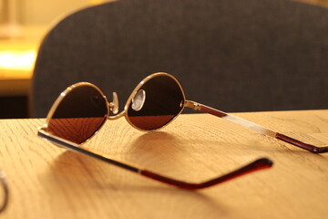 Fototapeta na wymiar Sunglasses on the table