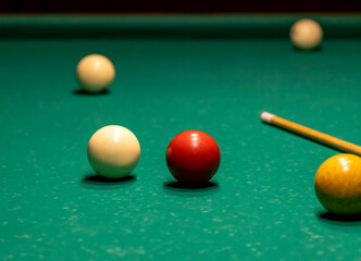 Close-up of the layers and cue for playing billiards.