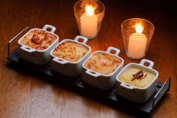 Traditional starters from Brazilian restaurants, known as escondidinho with octopus, cheese, shrimp and meat.