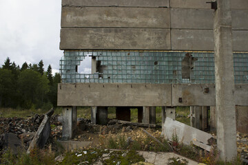 ruined industrial building on stilts with a broken wall of glass fragments. A picture of desolation...