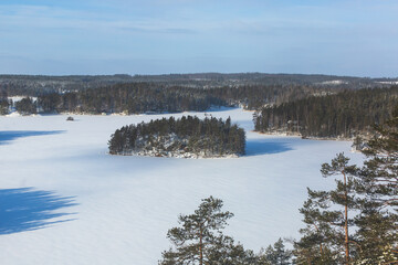 Repovesi National Park, aerial winter view, landscape view of a finnish park, southern Finland, Kouvola and Mantyharju, region of Kymenlaakso, with a group of tourists and wooden infrastructure