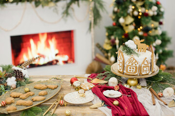 Table with Christmas dinner near fireplace
