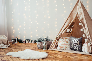 Children's Christmas Location. Beige Wigwam Decorated. Photo Zone for children in Rustic Style. © maxfotoadobe