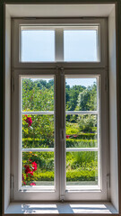 Obraz na płótnie Canvas Blick in einen Garten durch ein geschlossenes Fenster