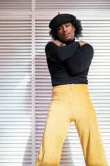 Portrait of African American young adult male in sensual and provocative attitude. Retro style,...