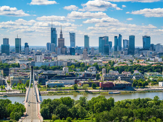 Fototapeta Swietokrzyski bridge and skyscrapers in city center, Warsaw aerial landscape under blue sky obraz